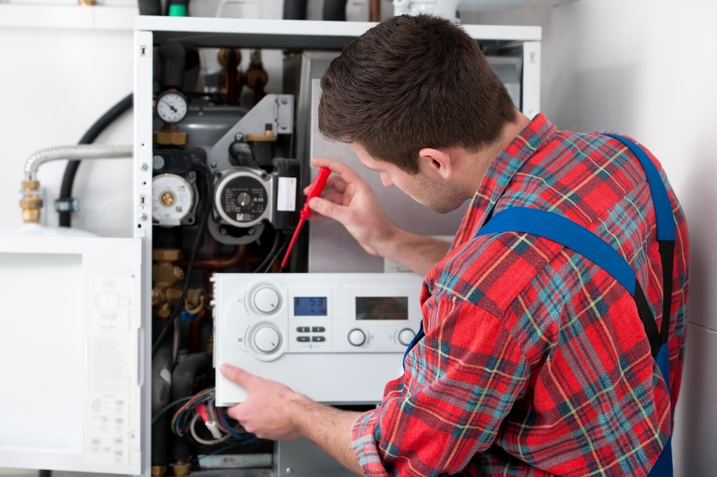 Gas Safe engineer working on a boiler in Waltham Abbey
